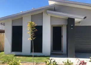 Amplimesh IntrudaGuard on the front of a house